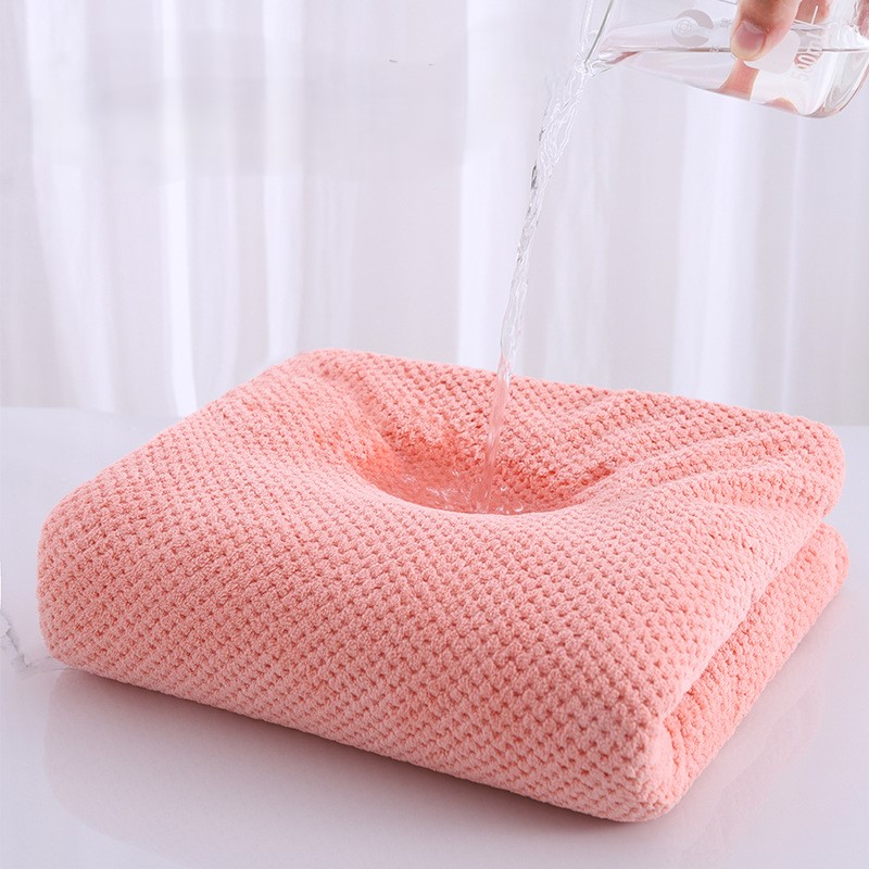 Person wearing changing robe at beach