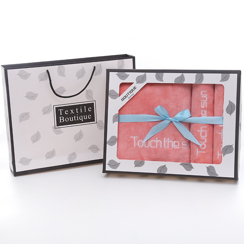 Eco packaging for custom beach towels - kraft paper wrap with printed logo