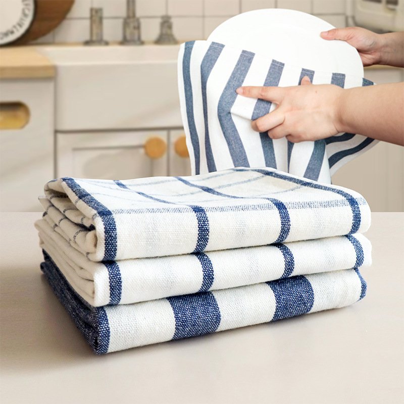 Color-coded kitchen towels organized by task for improved kitchen towel organization