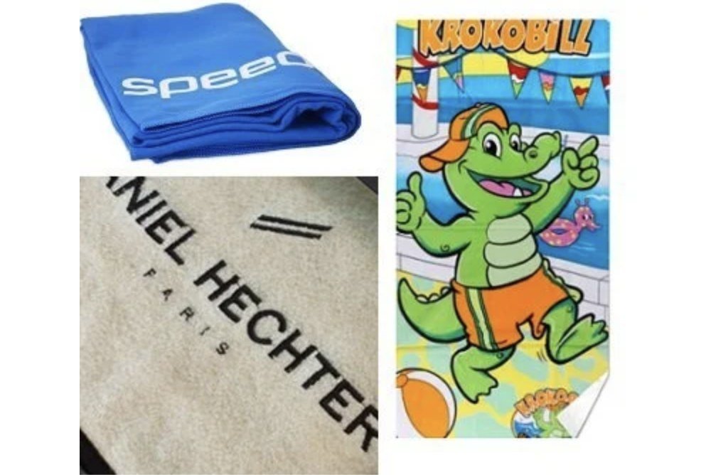 Blue logo towel, close-up of black textile branding and a colorful crocodile-print towel