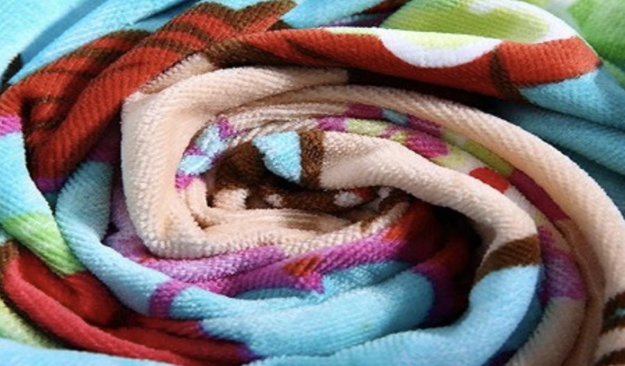Close-up of a colorful cotton towel with visible terry fabric texture