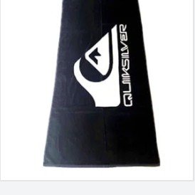 Black towel with a white Quiksilver logo
